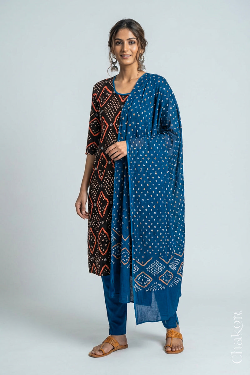 Model wearing Handcrafted Blue Bandhani Cotton Kurta and Indigo Blue Pant Set with Dupatta with traditional design and hand embroidery.