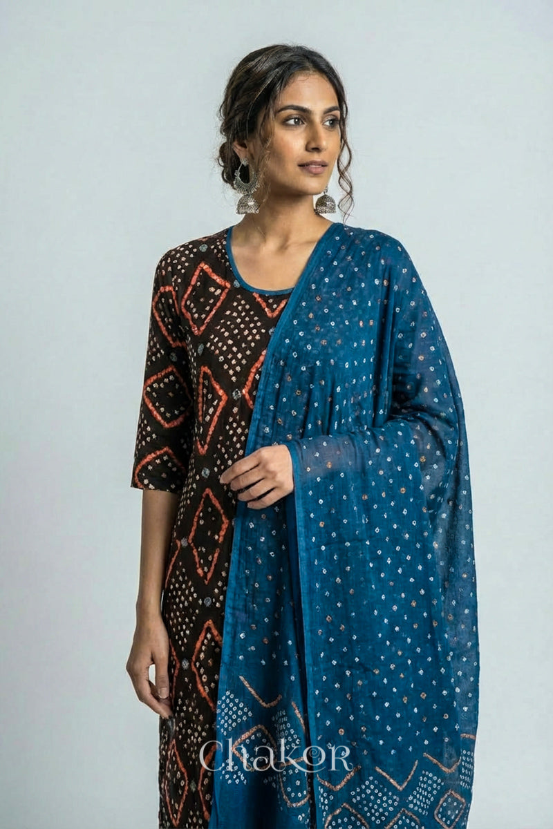 Model wearing Handcrafted Blue Bandhani Cotton Kurta and Indigo Blue Pant Set with Dupatta with traditional design and hand embroidery.