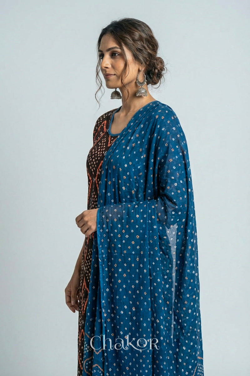 Model wearing Handcrafted Blue Bandhani Cotton Kurta and Indigo Blue Pant Set with Dupatta with traditional design and hand embroidery.