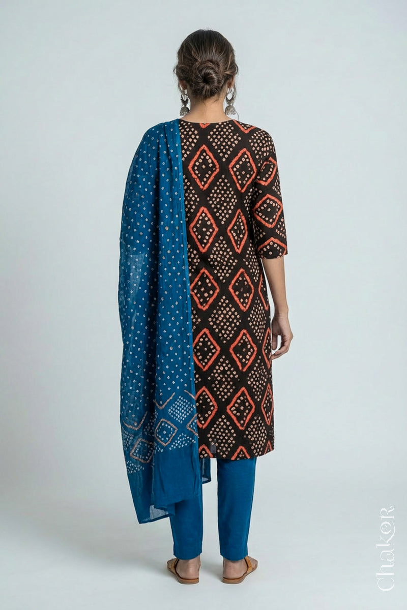 Model wearing Handcrafted Blue Bandhani Cotton Kurta and Indigo Blue Pant Set with Dupatta with traditional design and hand embroidery.