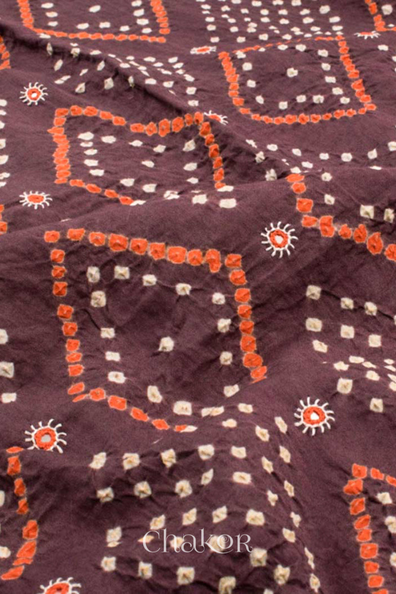 Close up of Handcrafted Brown Bandhani Cotton Kurta and Rust Pant Set with Dupatta with traditional design and hand embroidery.