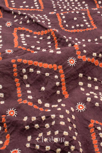 Close up of Handcrafted Brown Bandhani Cotton Kurta and Rust Pant Set with Dupatta with traditional design and hand embroidery.