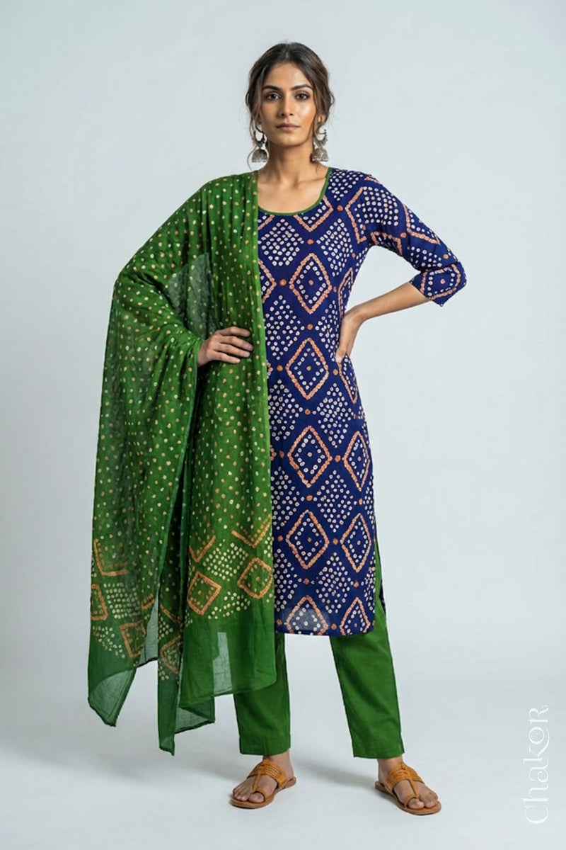 Model wearing Handcrafted Blue Bandhani Cotton Kurta and Mehendi green Pant Set with Dupatta with traditional design and hand embroidery.