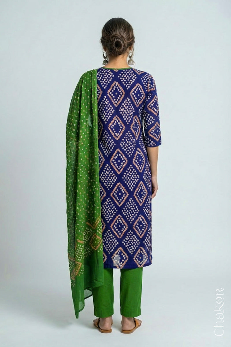 Model wearing Handcrafted Blue Bandhani Cotton Kurta and Mehendi green Pant Set with Dupatta with traditional design and hand embroidery.