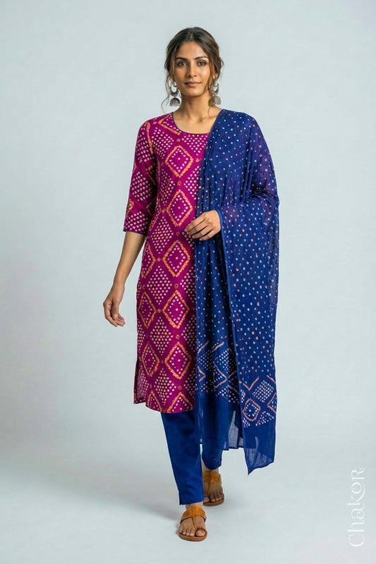 Model wearing Handcrafted Magenta Bandhani Cotton Kurta and Blue Pant Set with Dupatta with traditional design and hand embroidery.