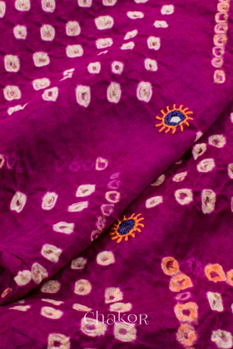 Close up of Handcrafted Magenta Bandhani Cotton Kurta and Blue Pant Set with Dupatta with traditional design and hand embroidery.