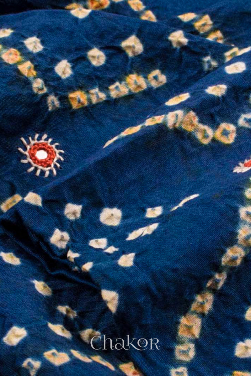 Close up detail of Handcrafted Indigo Blue Bandhani Cotton Kurta and Rust Pant Set with Dupatta with traditional design and hand embroidery.