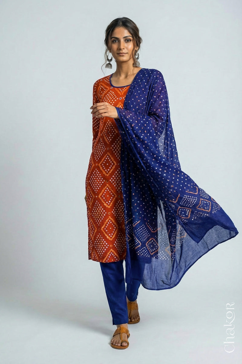 Model wearing Handcrafted Rust Blue Bandhani Cotton Kurta Pant Set with Dupatta with traditional design and hand embroidery.