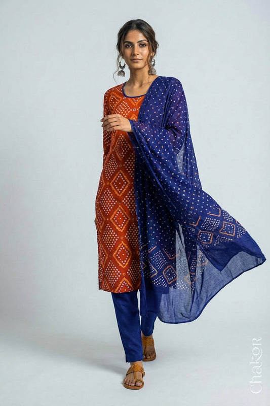 Model wearing Handcrafted Rust Blue Bandhani Cotton Kurta Pant Set with Dupatta with traditional design and hand embroidery.