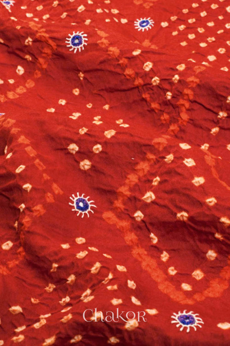 Close up of Handcrafted Rust Bandhani Cotton Kurta and Blue Pant Set with Dupatta with traditional design and hand embroidery.