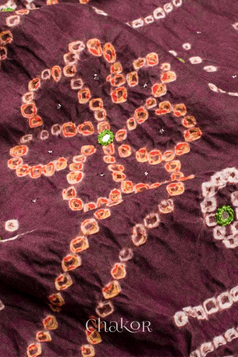 Close up of Handcrafted Brown Bandhani Cotton Kurta and green Pant Set with Dupatta with traditional floral design and mirror and mukaish hand embroidery.
