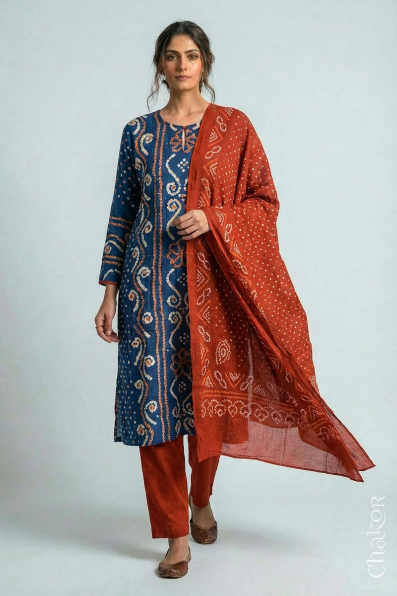 Model wearing Indigo Blue Bandhani Cotton Tunic with Rust Pant with Dupatta, Handcrafted in Kutch with traditional tie-dye design and hand embroidery.