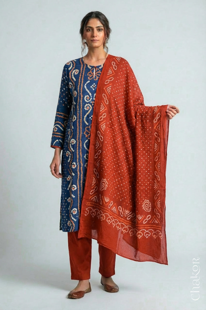 Model wearing Indigo Blue Bandhani Cotton Tunic with Rust Pant with Dupatta, Handcrafted in Kutch with traditional tie-dye design and hand embroidery.