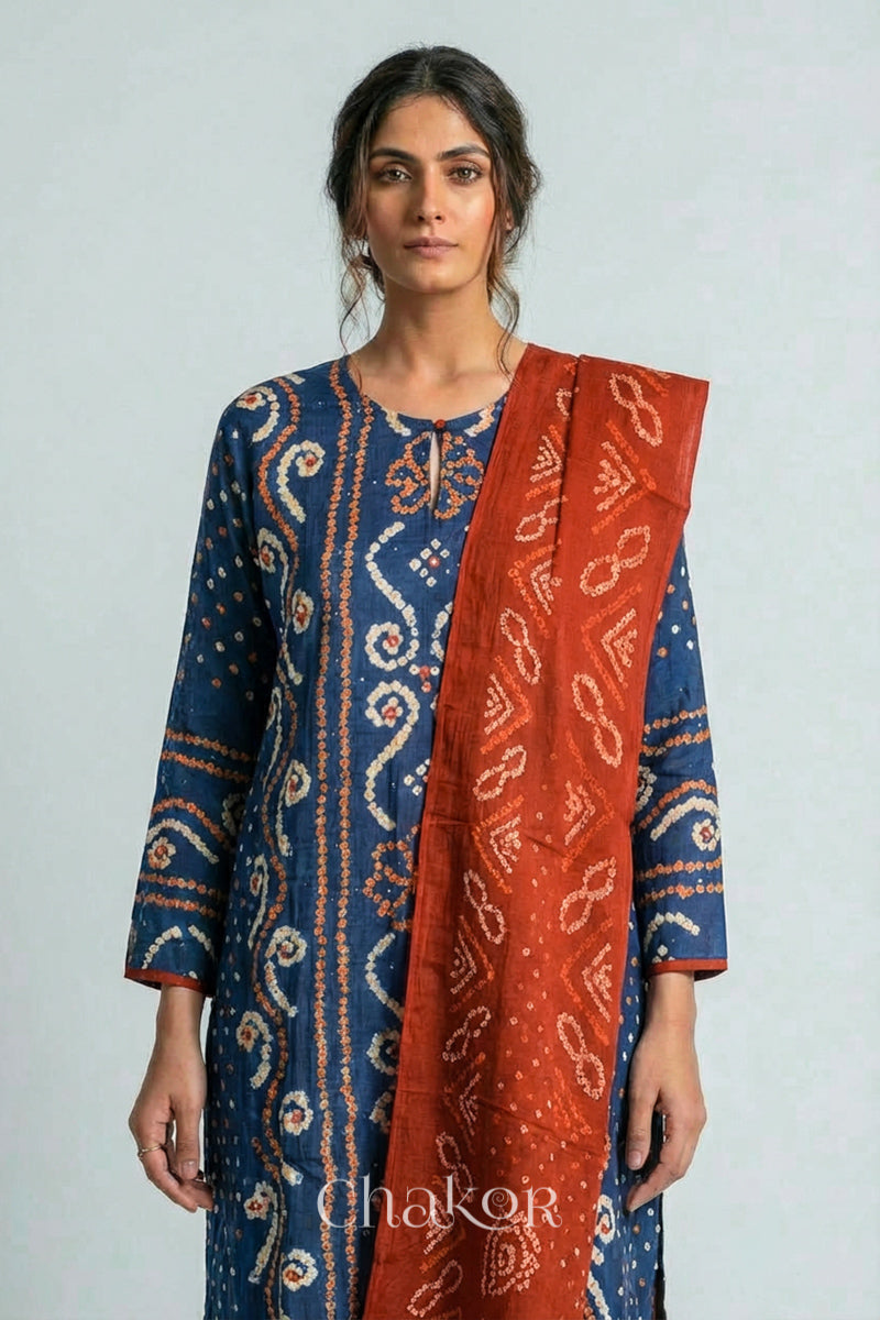 Model wearing Indigo Blue Bandhani Cotton Tunic with Rust Pant with Dupatta, Handcrafted in Kutch with traditional tie-dye design and hand embroidery.