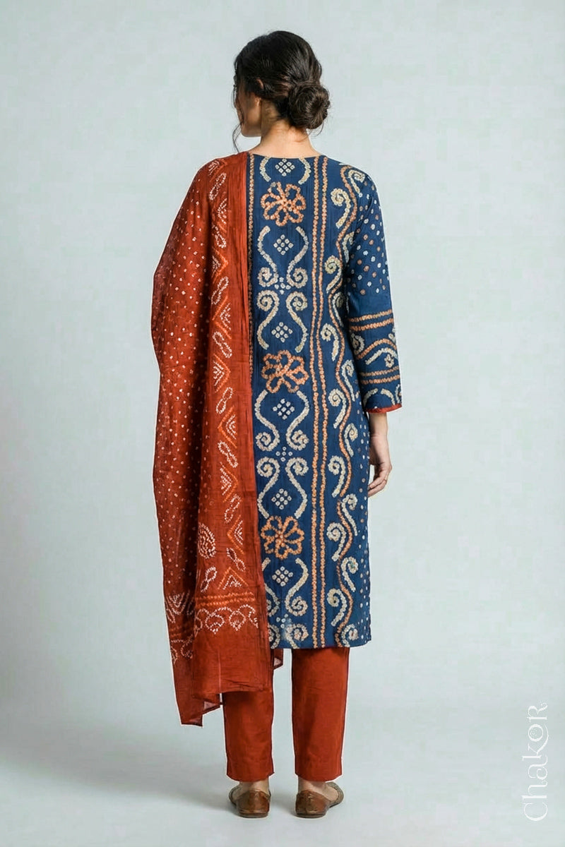 Model wearing Indigo Blue Bandhani Cotton Tunic with Rust Pant with Dupatta, Handcrafted in Kutch with traditional tie-dye design and hand embroidery.