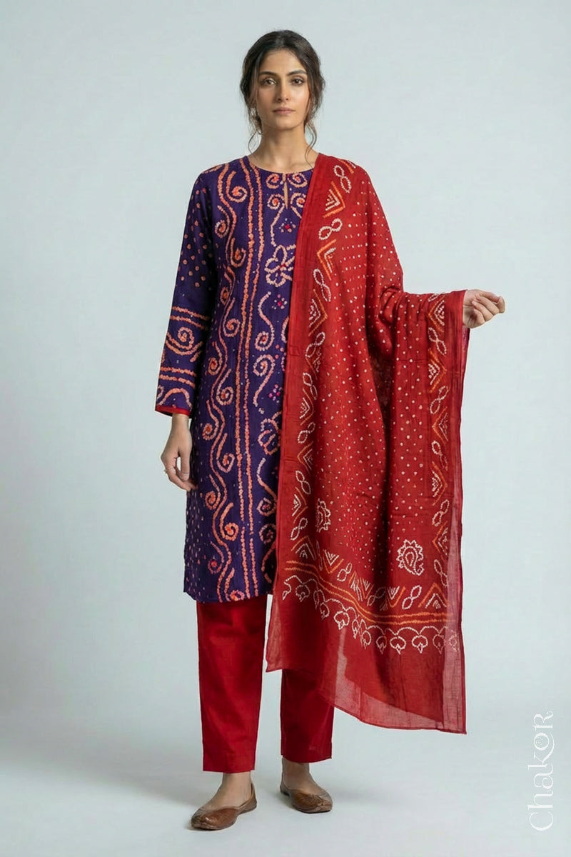 Model wearing Purple Bandhani Cotton Tunic with Red Pant with Dupatta, Handcrafted in Kutch with traditional design and hand embroidery.