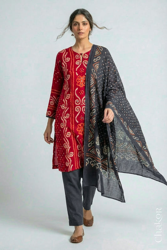 Model wearing Red Bandhani Cotton Tunic with Charcoal gray Pant with Dupatta, Handcrafted in Kutch with traditional design and hand embroidery.