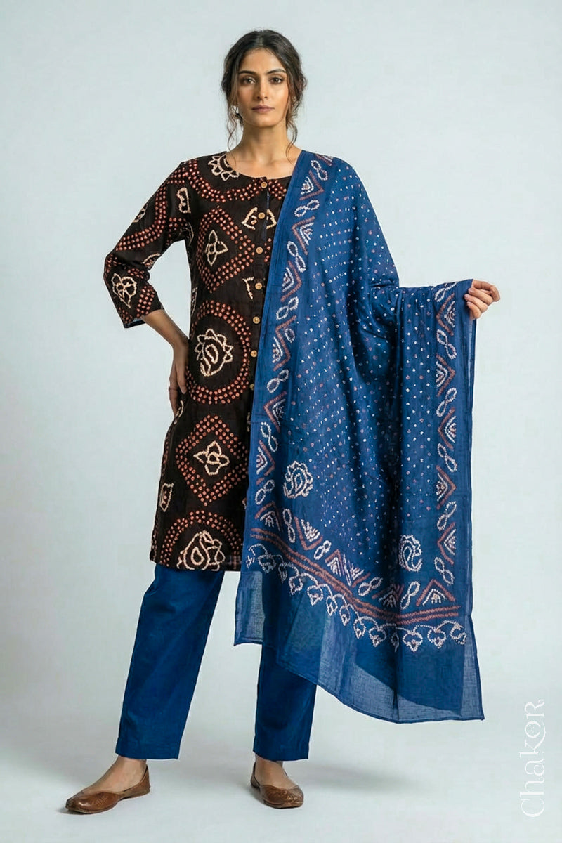 Woman wearing a handcrafted Black Indigo Kurta Set and a matching dupatta.