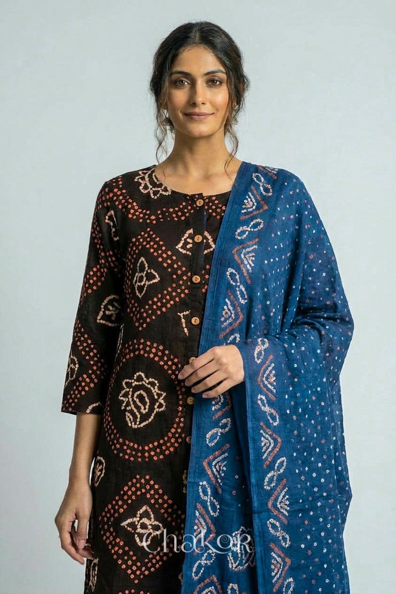 Woman wearing a handcrafted Black Indigo Kurta Set and a matching dupatta.