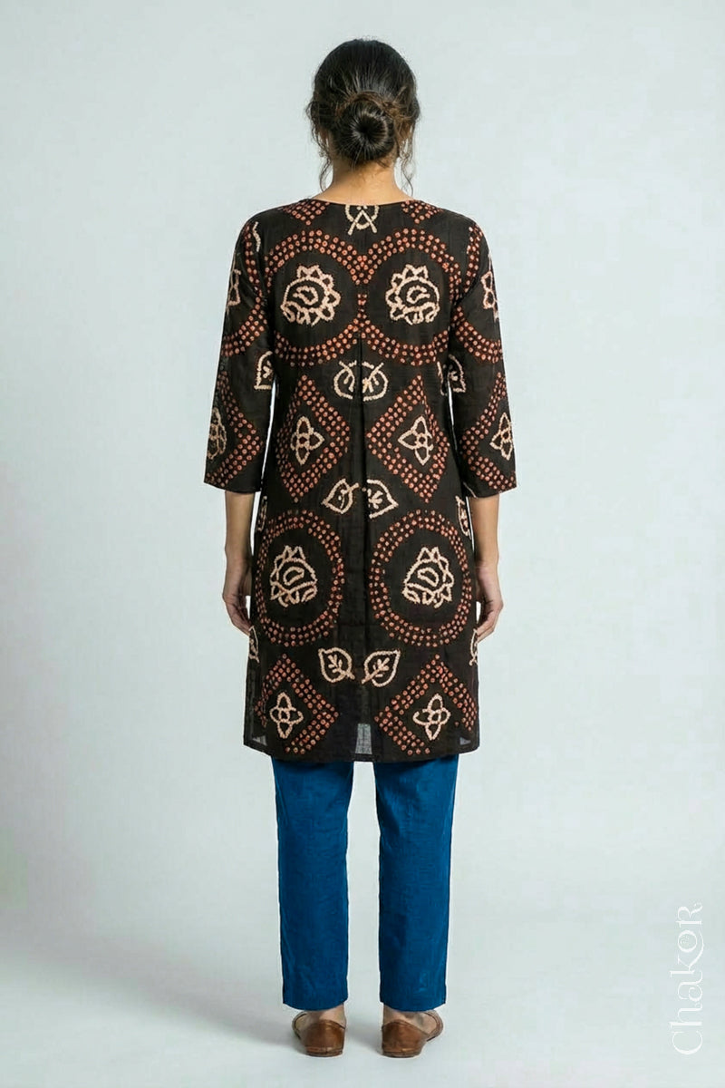 Woman wearing a handcrafted Black Indigo Kurta Set and a matching dupatta.