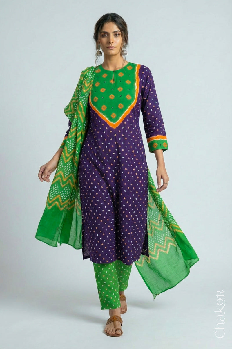 Model wearing Handcrafted Purple Mehendi Bandhani Cotton Kurta Set with kutch hand embroidery and paired with laher pattern Dupatta. 