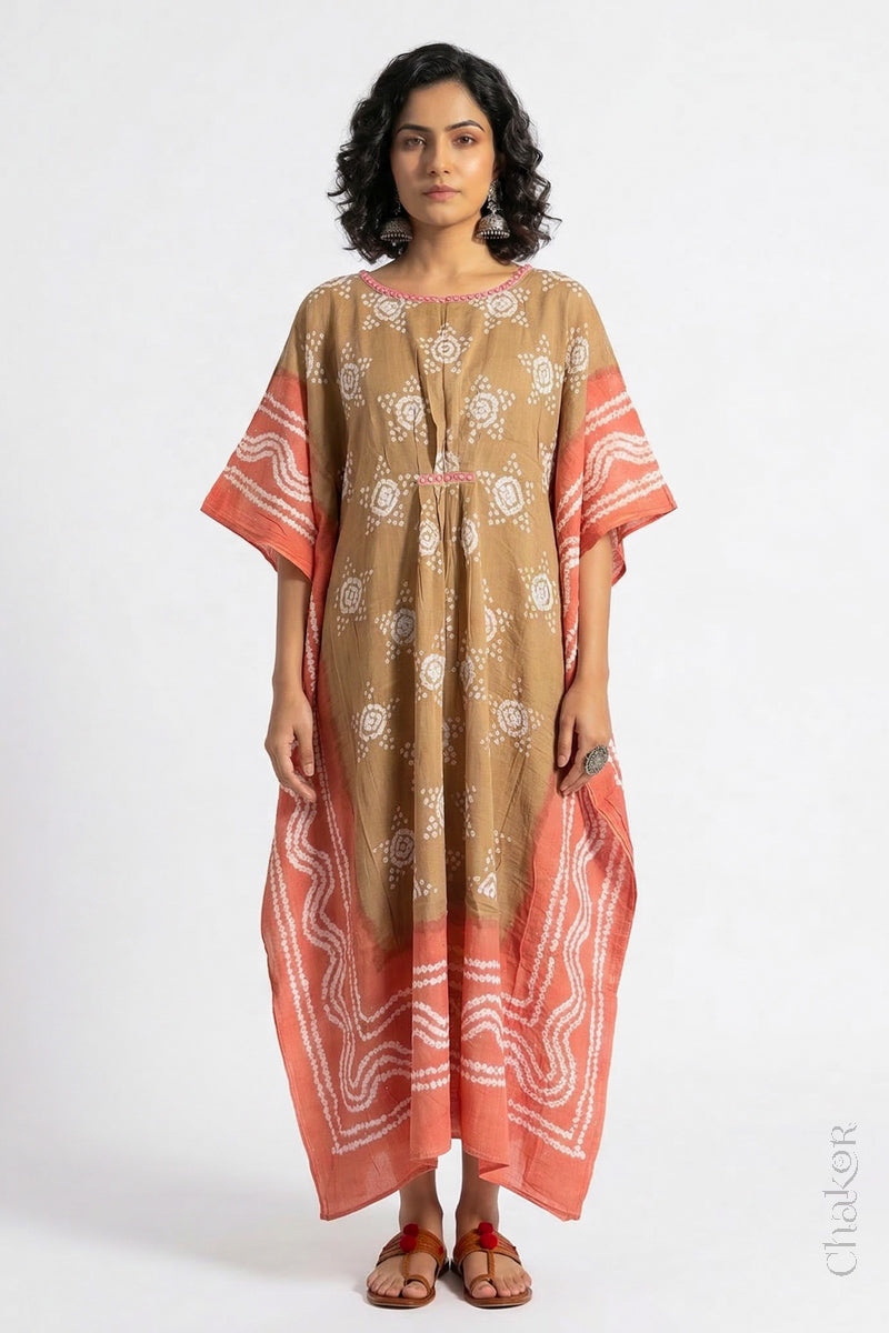 Handcrafted Kutch bandhani kaftan dress in breathable mulmul cotton with mirror & mukaish work.
