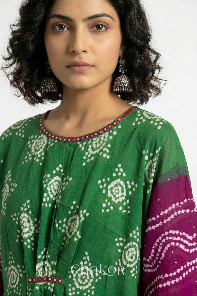 Bandhani kaftan neckline with mirror work detail in green and magenta mulmul cotton for summer.
