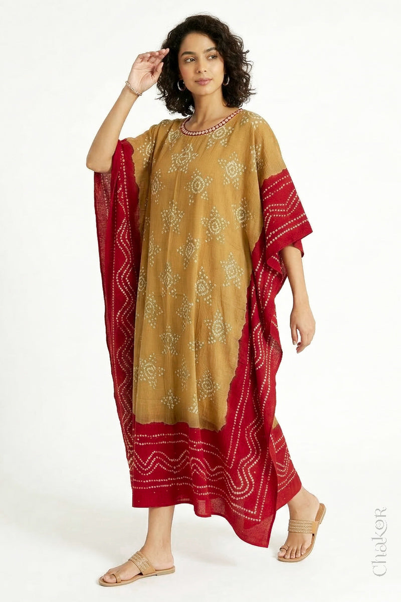 Mulmul cotton bandhani kaftan dress for women with mirror work in mustard and red, relaxed fit for summer.
