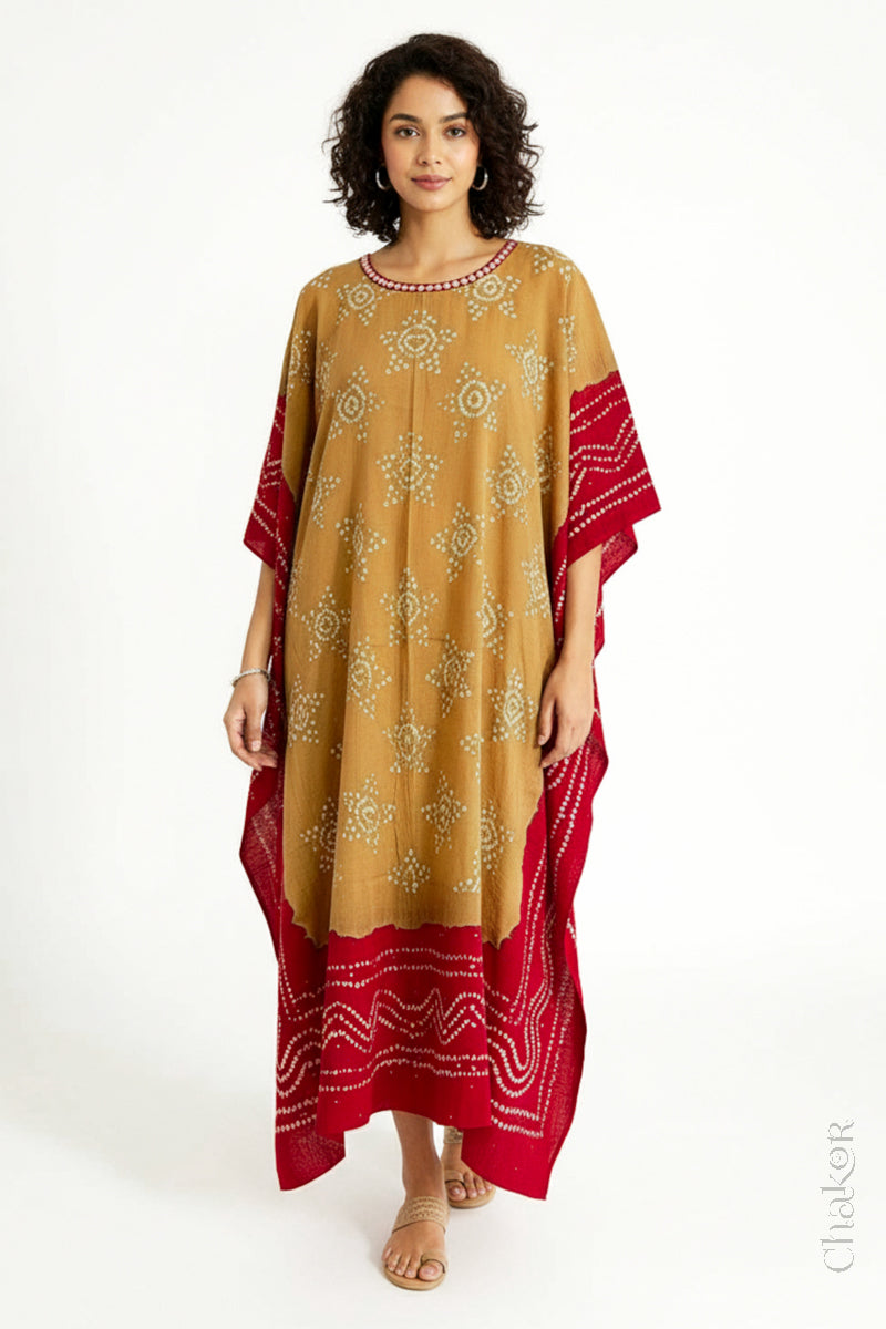 Handcrafted Kutch bandhani kaftan dress in breathable mulmul cotton with mirror & mukaish work.

