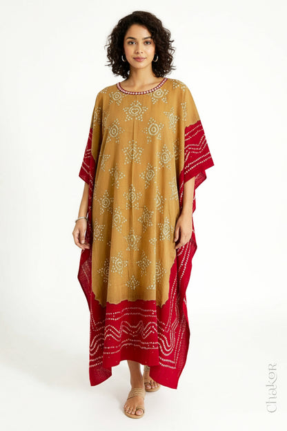 Handcrafted Kutch bandhani kaftan dress in breathable mulmul cotton with mirror & mukaish work.
