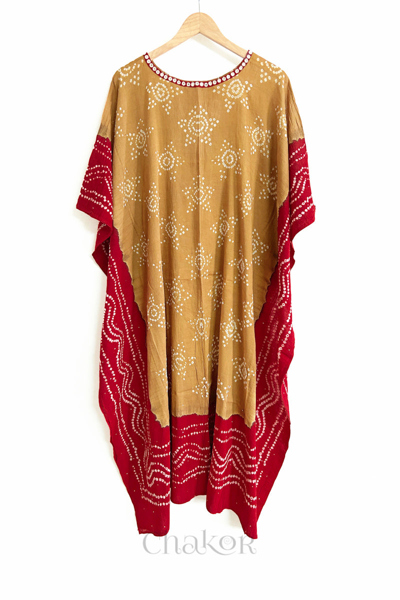 Handcrafted Kutch bandhani women's kaftan hanging full length in mulmul cotton with mirror work, loose fit for summer.

