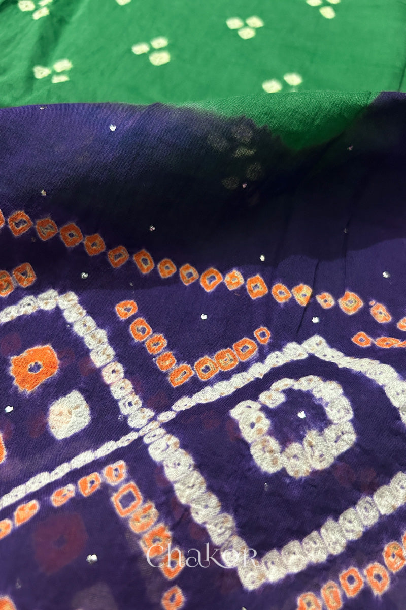 Mulmul cotton bandhani fabric with mukaish embroidery detail in green and purple.

