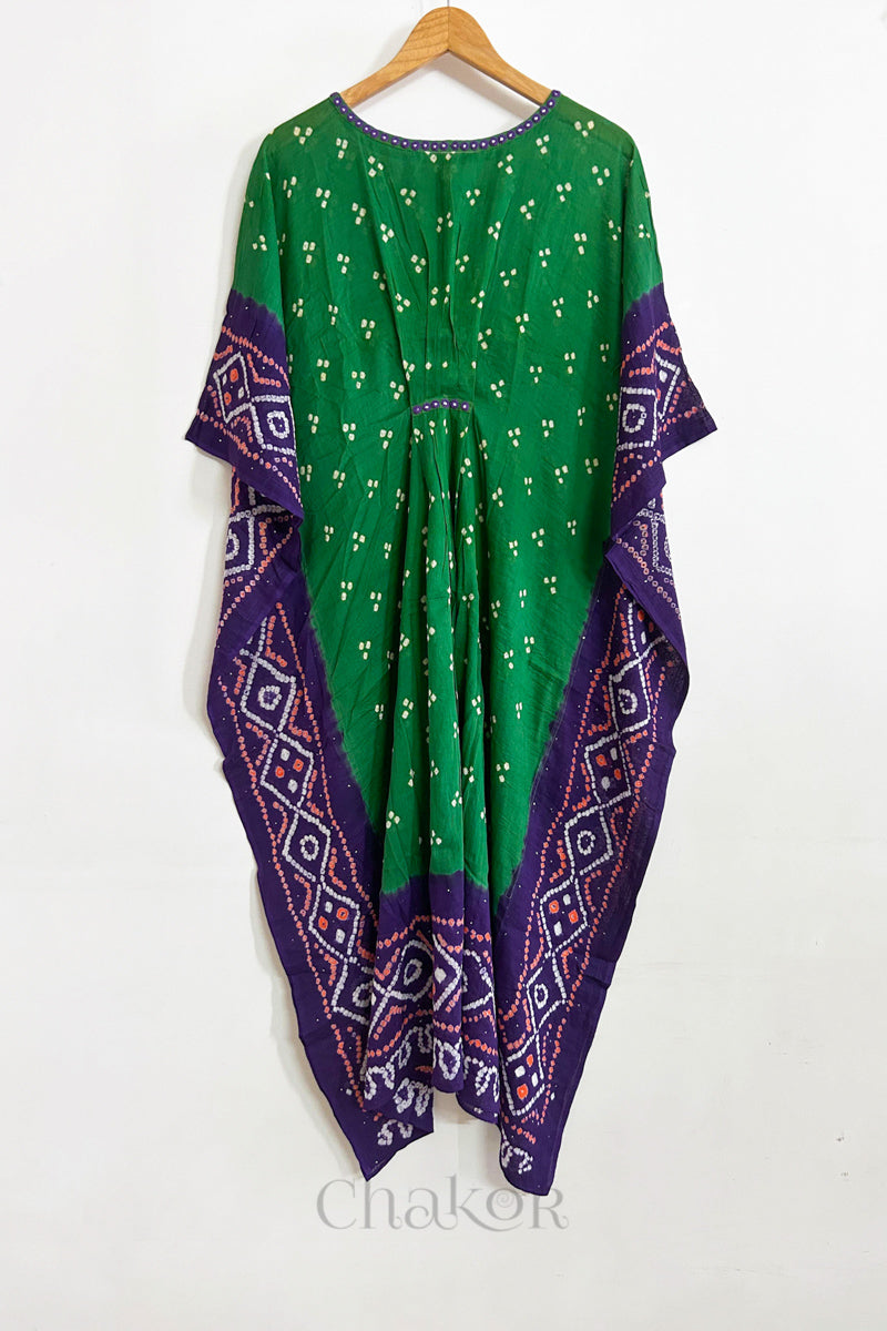 Handcrafted Kutch bandhani women's kaftan hanging full length in mulmul cotton with mirror work, loose fit for summer.
