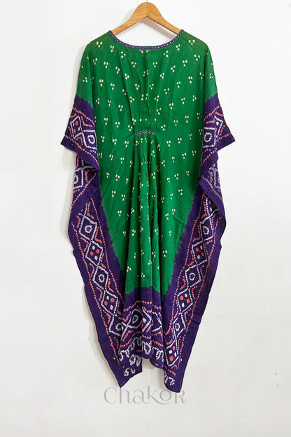 Handcrafted Kutch bandhani women's kaftan hanging full length in mulmul cotton with mirror work, loose fit for summer.
