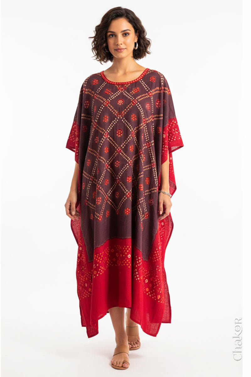 Handcrafted Kutch bandhani kaftan dress in breathable mulmul cotton with mirror & mukaish work.
