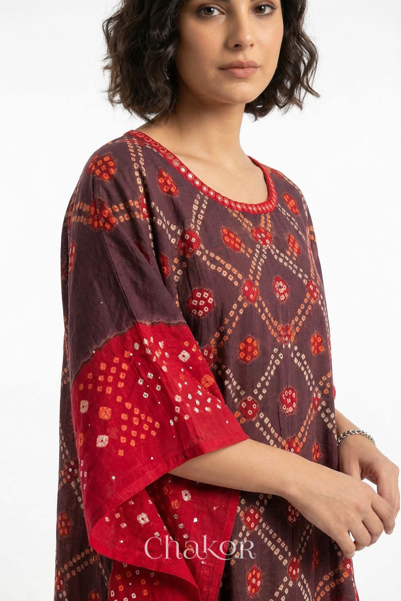 Mirror work neckline detail on mulmul cotton bandhani kaftan in brown and red, handcrafted in Kutch.
