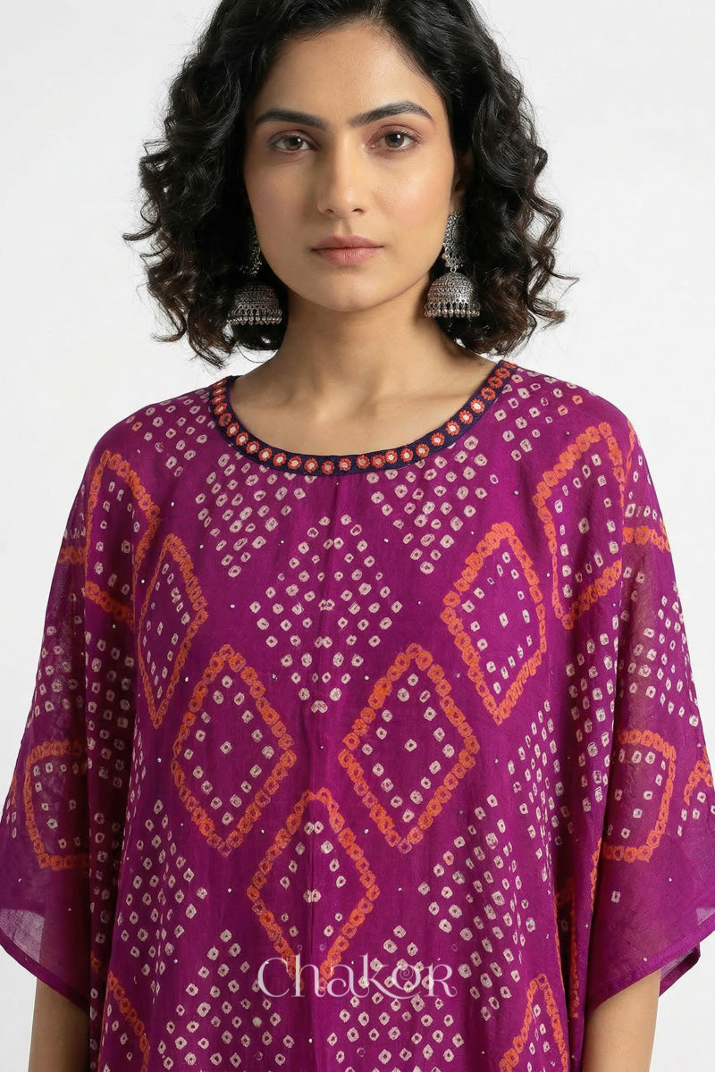 Bandhani kaftan neckline with mirror work detail in magenta mulmul cotton for summer.
