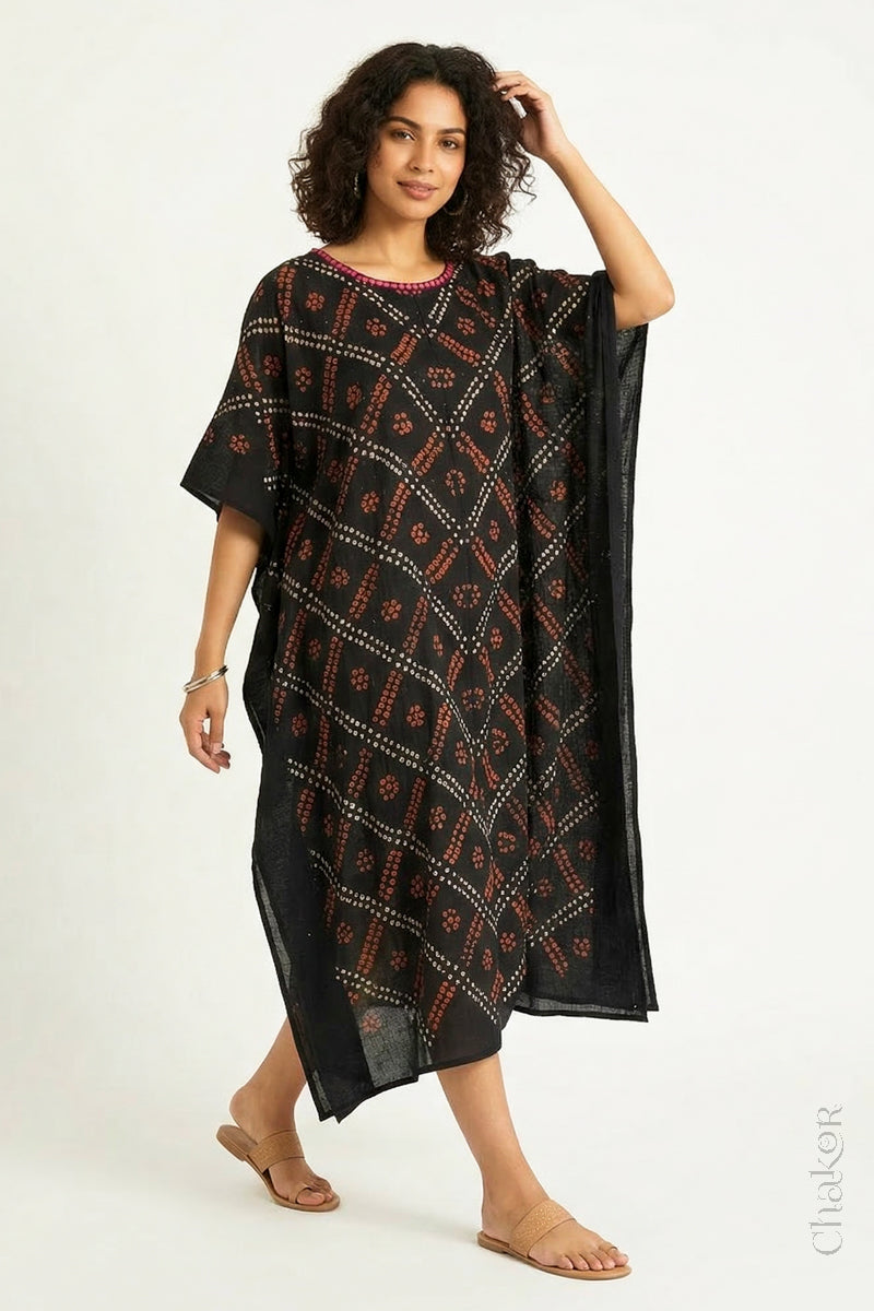 Handcrafted Kutch bandhani kaftan dress in breathable mulmul cotton with mirror & mukaish work.
