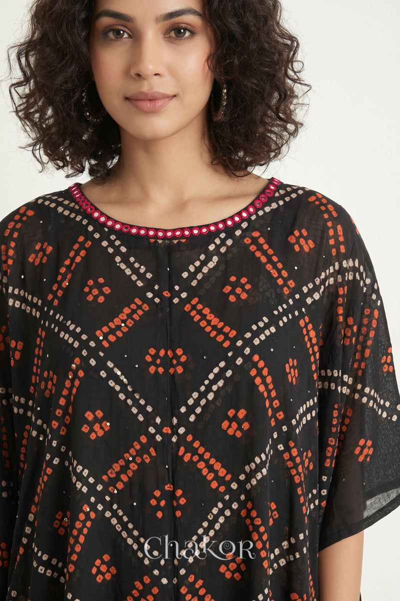 Bandhani kaftan neckline with mirror work detail in black mulmul cotton for summer.
