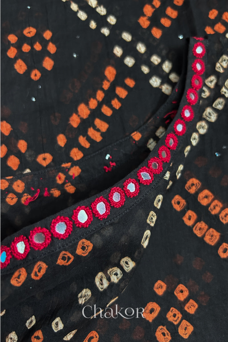 Mirror work neckline detail on mulmul cotton bandhani kaftan in black, handcrafted in Kutch.

