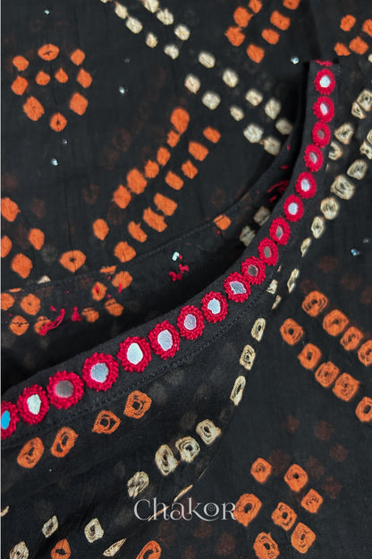 Mirror work neckline detail on mulmul cotton bandhani kaftan in black, handcrafted in Kutch.
