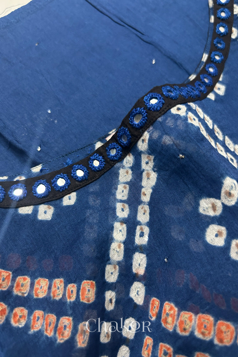 Mirror work neckline detail on mulmul cotton bandhani kaftan in indigo, handcrafted in Kutch.
