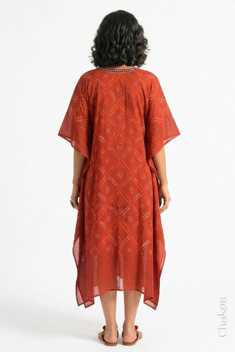 Handcrafted Kutch bandhani kaftan dress in breathable mulmul cotton with mirror & mukaish work.
