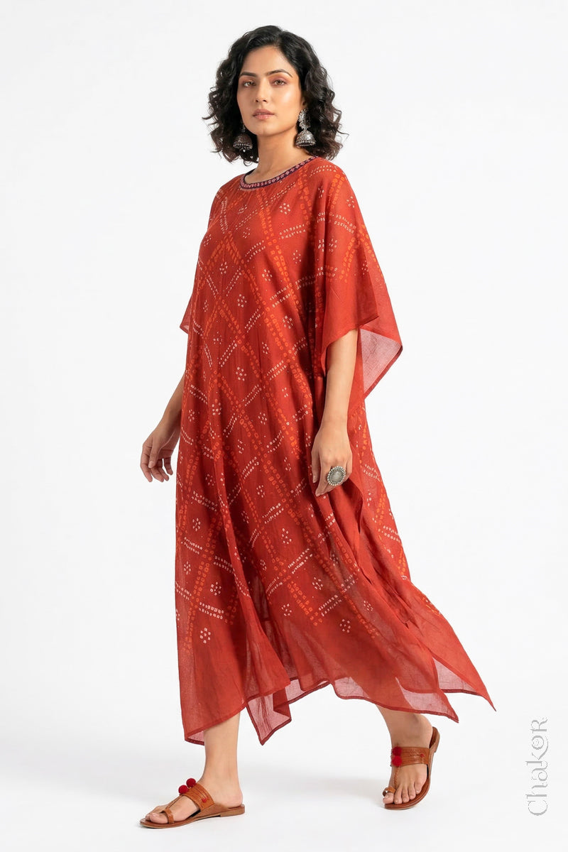Handcrafted Kutch bandhani kaftan dress in breathable mulmul cotton with mirror & mukaish work.
