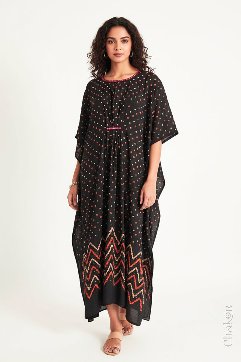 Handcrafted Kutch bandhani kaftan dress in breathable mulmul cotton with mirror & mukaish work.
