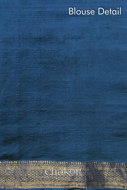 Blouse detail of indigo blue bandhani saree with woven golden zari border. Watermark text reads 'Chakor'.