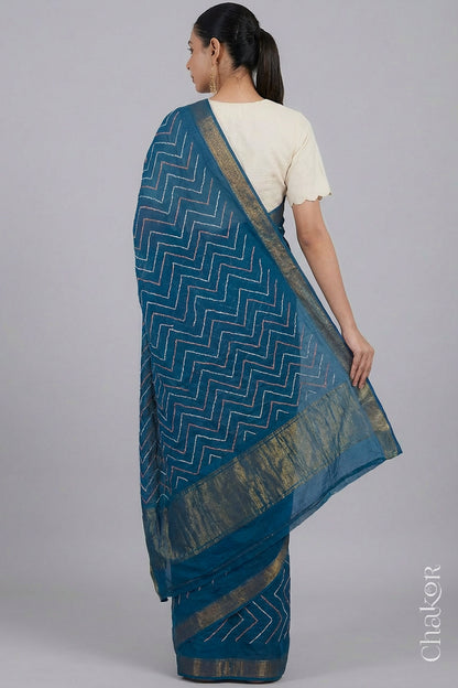 Woman wearing Indigo Blue Bandhani Mangalagiri Handloom Cotton Saree, with handcrafted rai bandhej patterns using traditional tie-dye techniques.