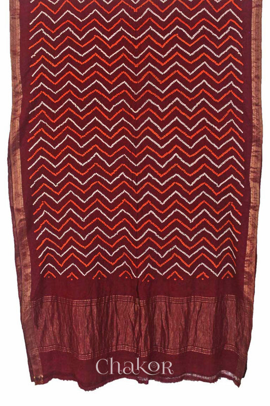 Maroon Traditional Bandhani Mangalgiri Cotton Saree with zari border and pallu by Chakor.