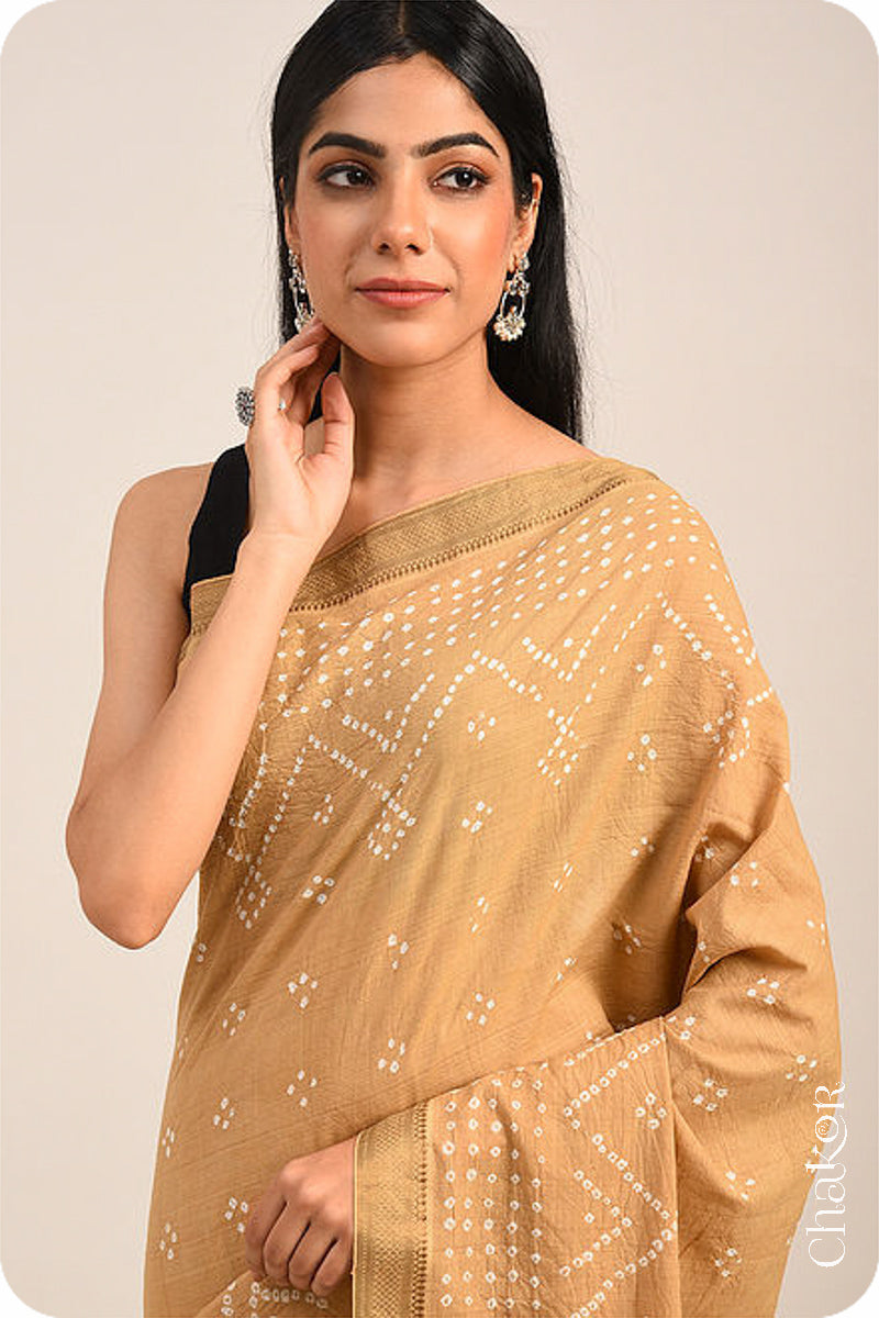 Beige Bandhani Mangalgiri Cotton Saree with zari border and pallu by Chakor.