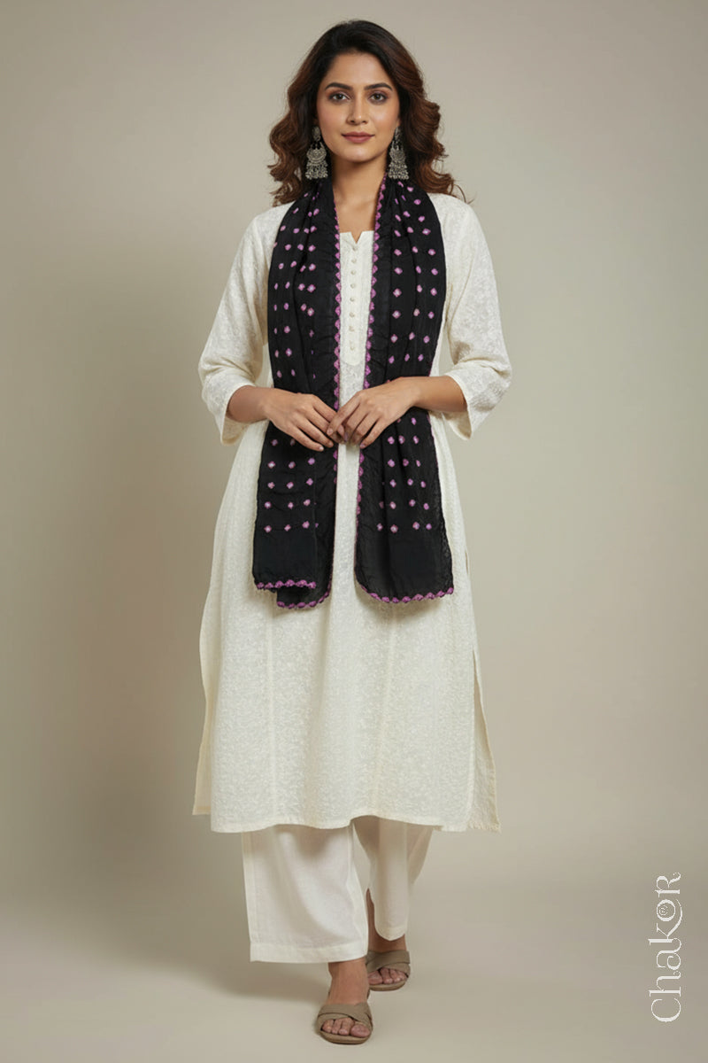 Model wearing a black Bandhani modal stole styled over a kurta, showing hand tie-dye patterns.
